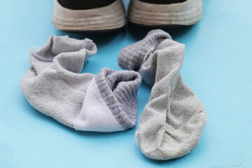 Black sneakers with dirty socks