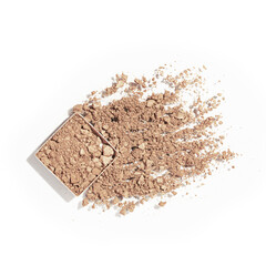 Crushed beige face powder cosmetic swatch isolated on white background. Makeup foundation powder texture. Matte nude broken eye shadow smear. Skin tone face cosmetic product sample, top view