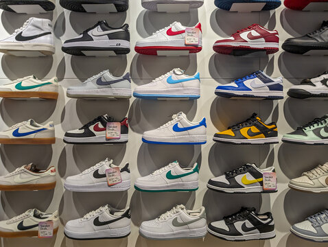 France, 8 May 2024: Wall Display of Nike Sneakers in Sportswear Store.