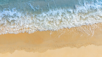 Top view nature of the beach and sea Summer with sunshine sandy beaches, clear blue waters sparkling against the blue sky. on an island with good ecology and environment Background for summer vacation