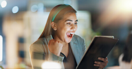 Tablet, wow and yes with business woman in office for motivation, success or surprise. Fist, night and technology with happy professional employee in corporate workplace for celebration or reaction