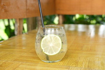 fresh Summer drink, lemon mojito with lemon slices.