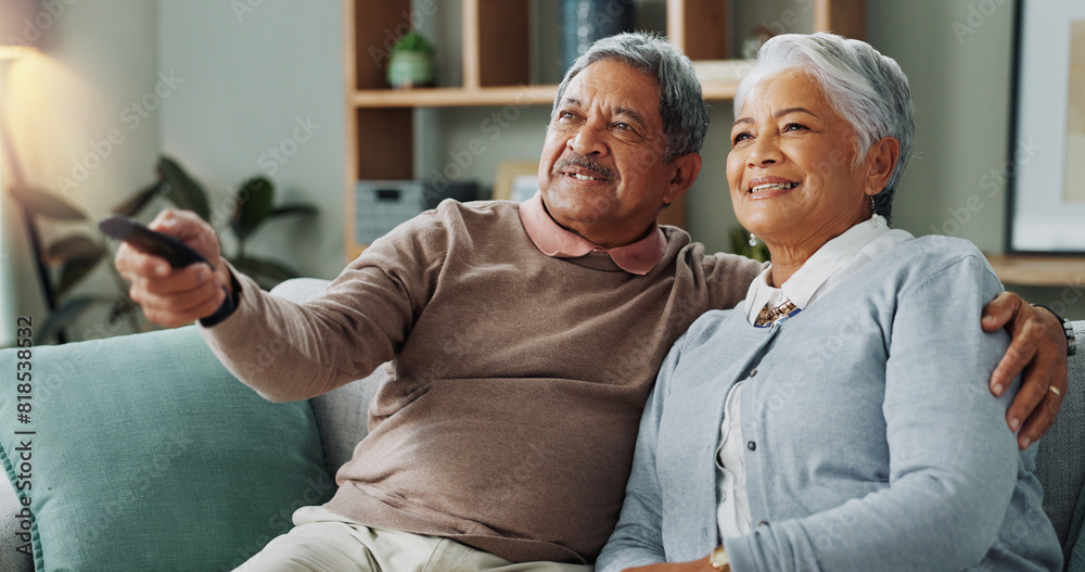 Poster Senior, couple and watching tv in home to relax with happiness on vacation or holiday in retirement. Elderly, man and woman hug on sofa and click choice for streaming comedy movies, series or film