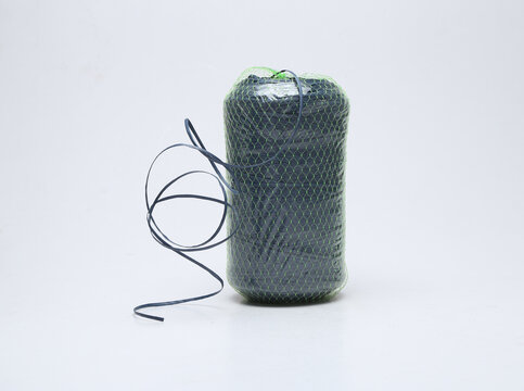 green plastic rope roll isolated on white background