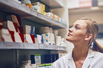 Woman, pharmacist or reading label for stock check or inventory at pharmacy for pills information. Medication, medical internship or girl looking at shelf for pharmaceutical drugs for box or product
