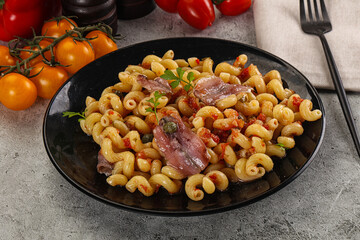 Italian pasta cellentani with anchovy