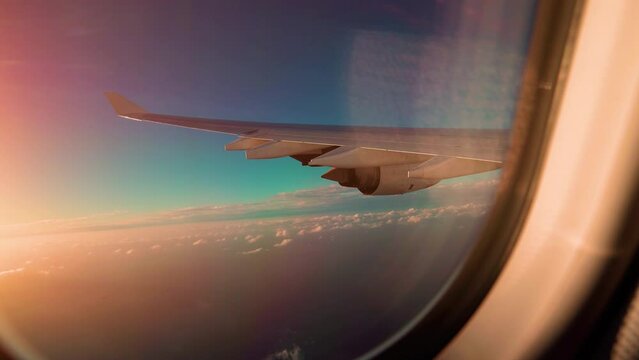 Flying above the clouds. View from the cabin window on the plane wing flying among the clouds. 