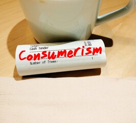 Receipt with handwritten text Consumerism, idea that increasing consumption of goods and services...