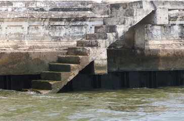 Concrete staircase leading into the river