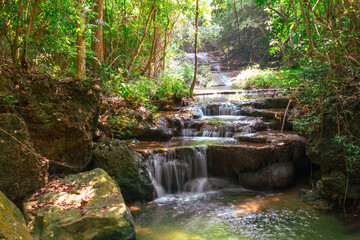 Waterfall along a tropical river in Thailand