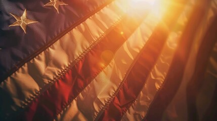 A close-up of a weathered American flag waving proudly, backlit by a warm, glowing sunset, symbolizing freedom and resilience