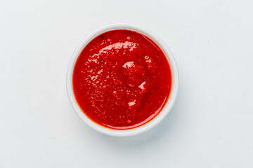bowl of red tomato sauce ketchup Isolated on white