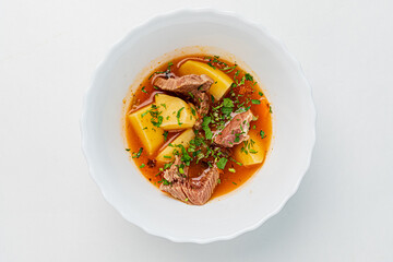 soup with veal on white background
