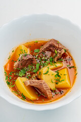 soup with veal on white background
