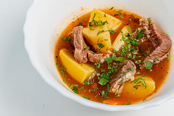 soup with veal on white background