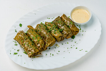 Stuffed grape leaves in a plate
