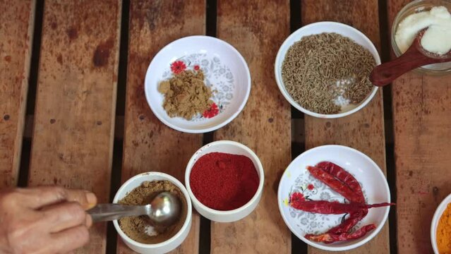 mixture of cumin powder with red chili powder in water