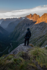 Epic view of snowy peaks during beautiful sunset red light