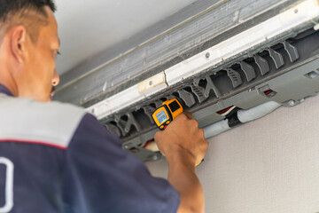Technicians check temperature service repair and maintenance of air conditioners, Repairman fix air...