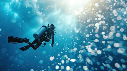 Scuba diver ascending towards sunlight in clear blue water
