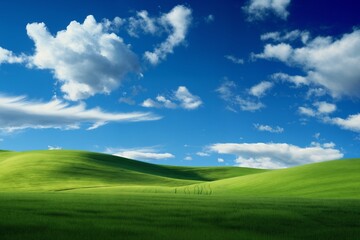 Fototapeta premium A beautiful summer or spring landscape with green grass on the hills and green fields. The blue sky is filled with white clouds and bright sunlight. Nature as a background.