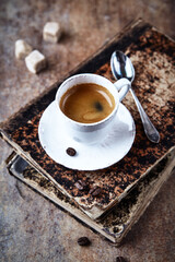 Cup of coffee on rustic stone background. Close up.	