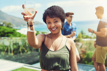 African woman, toast and portrait at party with drink, champagne and smile with celebration in...