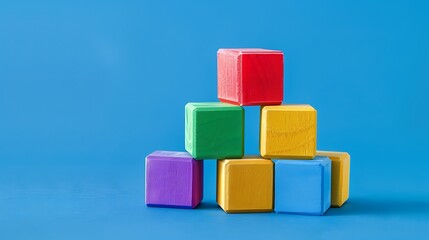 Obraz premium a cylindrical building block in a stack of rectangular building blocks on a blue background