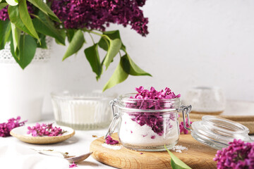 Preparation of syrup from the flowers of lilac. Glassware. White background. Selective focus. copy space