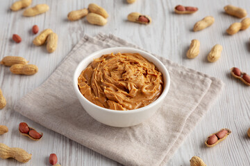 Organic Raw Peanut Butter in a Bowl, side view.