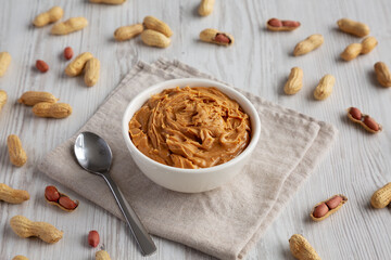 Organic Raw Peanut Butter in a Bowl, side view.