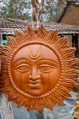 isolated clay art of hindu holy god sun at day