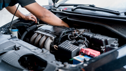 The mechanic performs repair and maintenance on the car's engine, ensuring the vehicle operates...