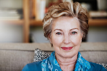 Senior woman, home and couch in portrait for relax with retirement, beauty glow with cosmetics....