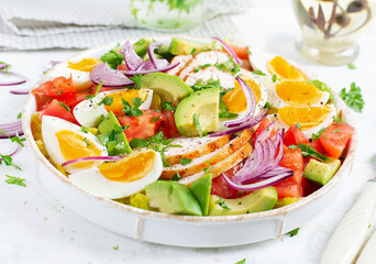 Healthy cobb salad with chicken, avocado, tomato, red onions and eggs. American food.