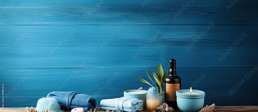 Poster blue wooden background with a spa set creating a beauty concept image. creative banner. copyspace im