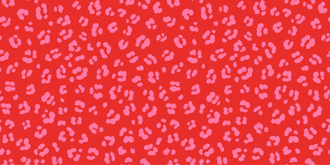 Hot pink on red leopard skin print seamless pattern. Pink cheetah spots on vivid red background trendy fun safari print. © Olga