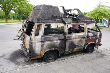 Burnt out minibus in Hannover - Stöcken, Germany on May 18, 2024
