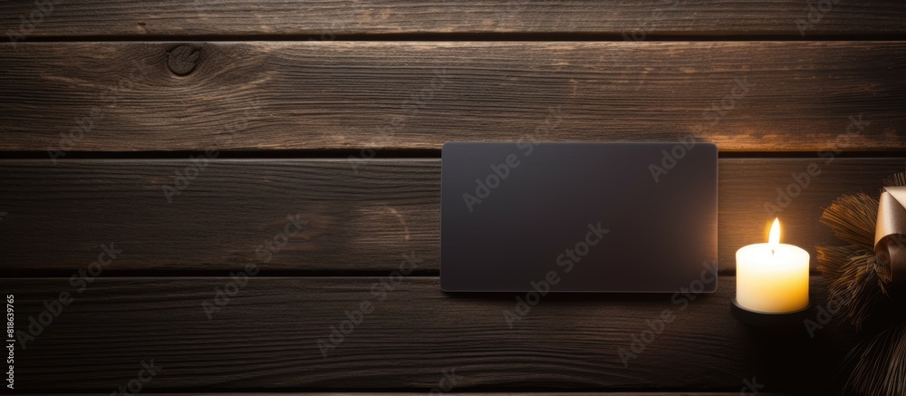 Poster On a dark wooden table there is a carbon soap placed next to an empty gift card creating a visually appealing copy space image