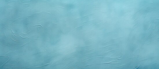 Obraz premium A copy space image of a textured background in a light blue cyan shade perfect for graphic design purposes