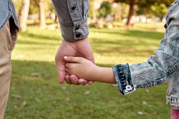 Child, parent and holding hands in nature or back, childhood development and growth with love for...