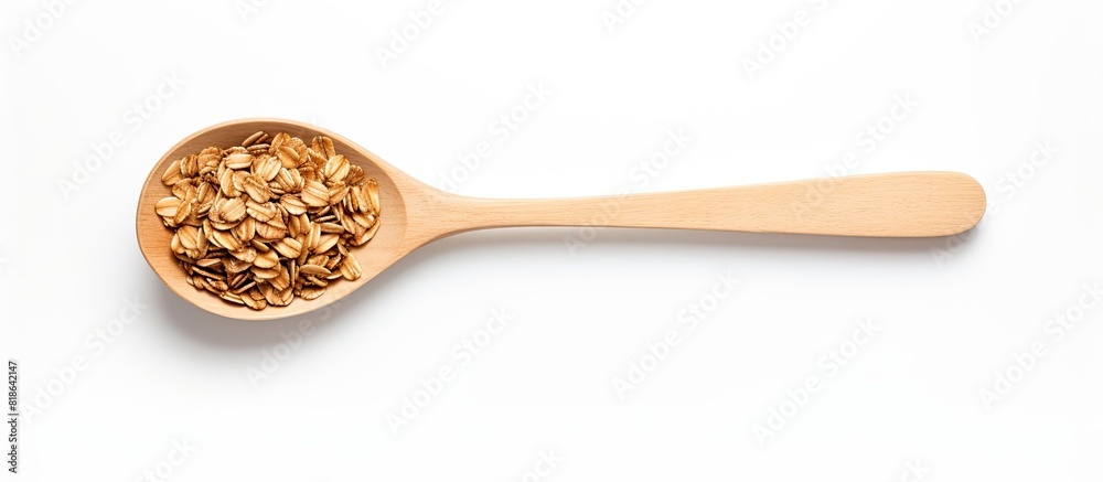 Poster A silver spoon with granola oats seen from above on a white background providing ample copy space for unique compositions