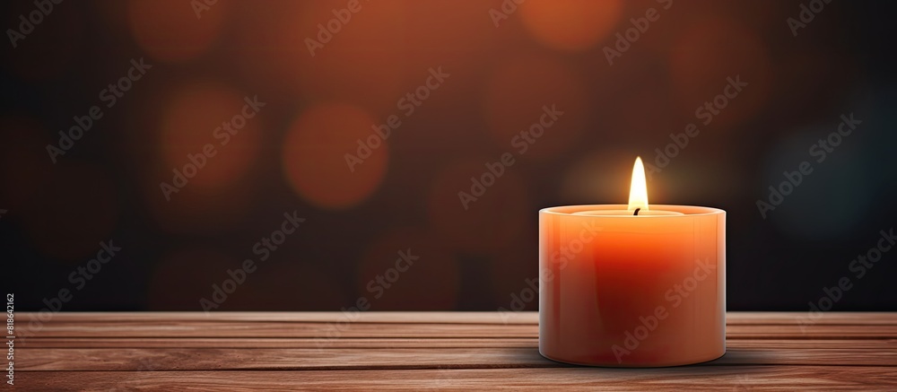Leinwandbilder A wooden top with a lit candle on it creating a warm and cozy ambiance A copy space image to be used in various settings