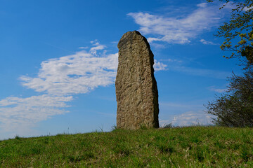 Rune stones in Sweden nearby Kallby. Old aged well preserved granite gravestone in sunny rays. Ancient big rocks with runes patterns. Vikings times. Old graves in Scandinavia. 