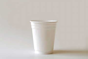 White plastic cup on an empty surface for mockup. Paper cup, coffee cup, disposable cup,  and paper mug without lid in isolated background. Suitable for branding, and advertising. AI generated