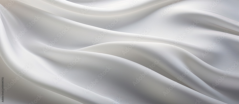 Poster closeup of a copy space image showcasing the delicate and textured ripples in a piece of white silk 