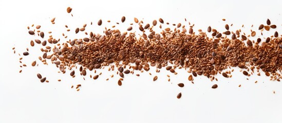 A healthy food concept featuring a white background with raw flax seeds scattered in a random...