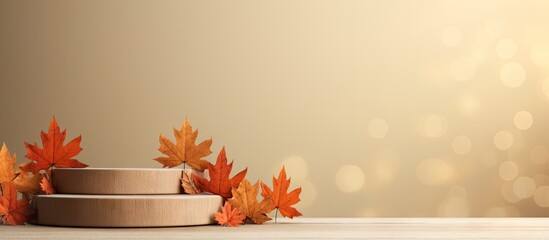 Beige background with wooden podiums decor and autumn leaves perfect for a fall seasonal copy space image