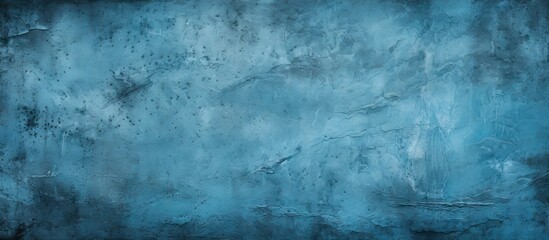 Obraz premium An abstract grunge background featuring a blue decorative plaster texture and a vignette providing ample copy space for design elements in the image