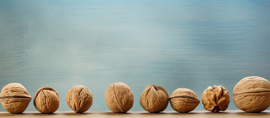 A close up image of walnuts with plenty of copy space